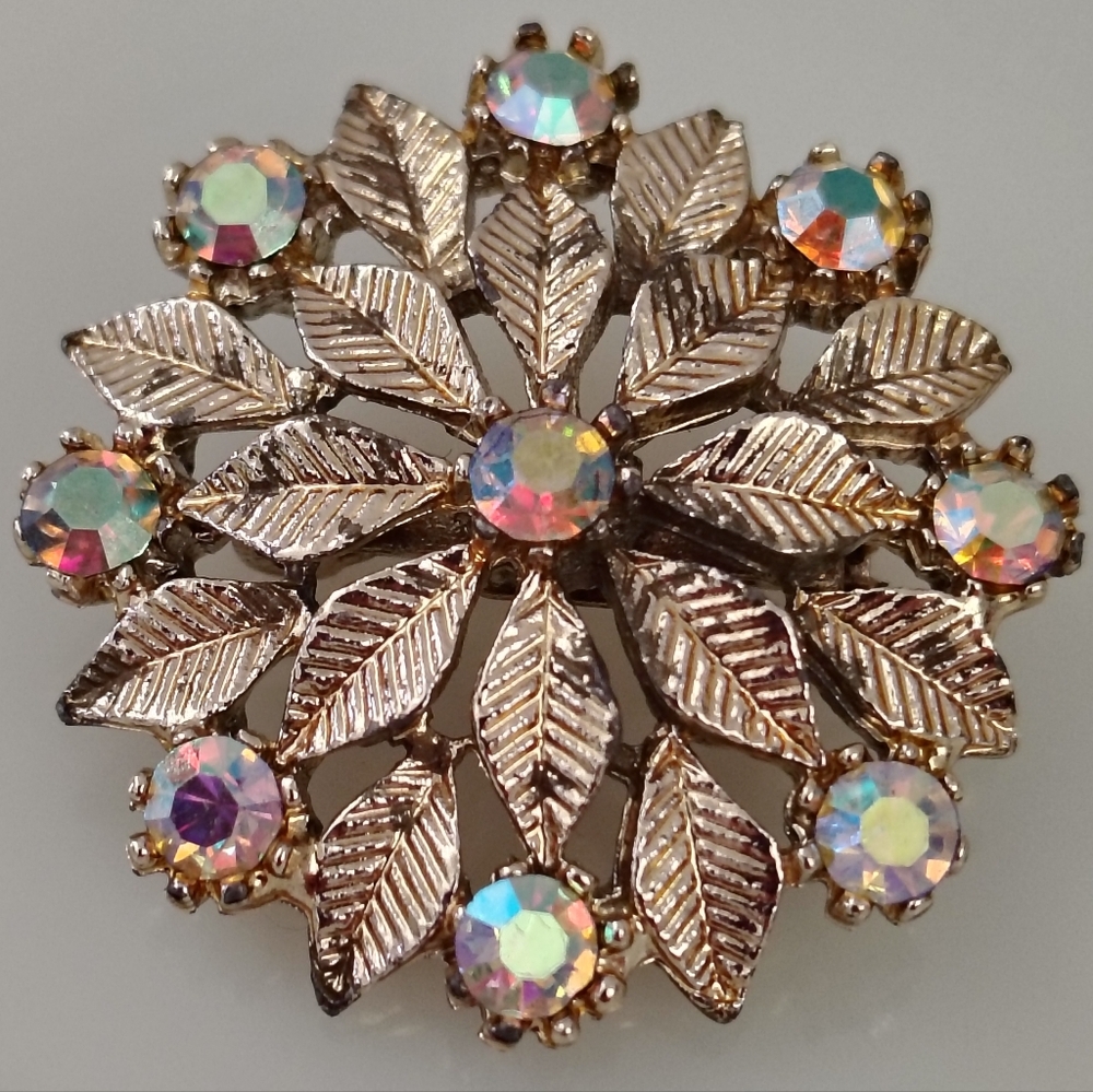 Elegant Gold Leaf Brooch with Iridescent Accents